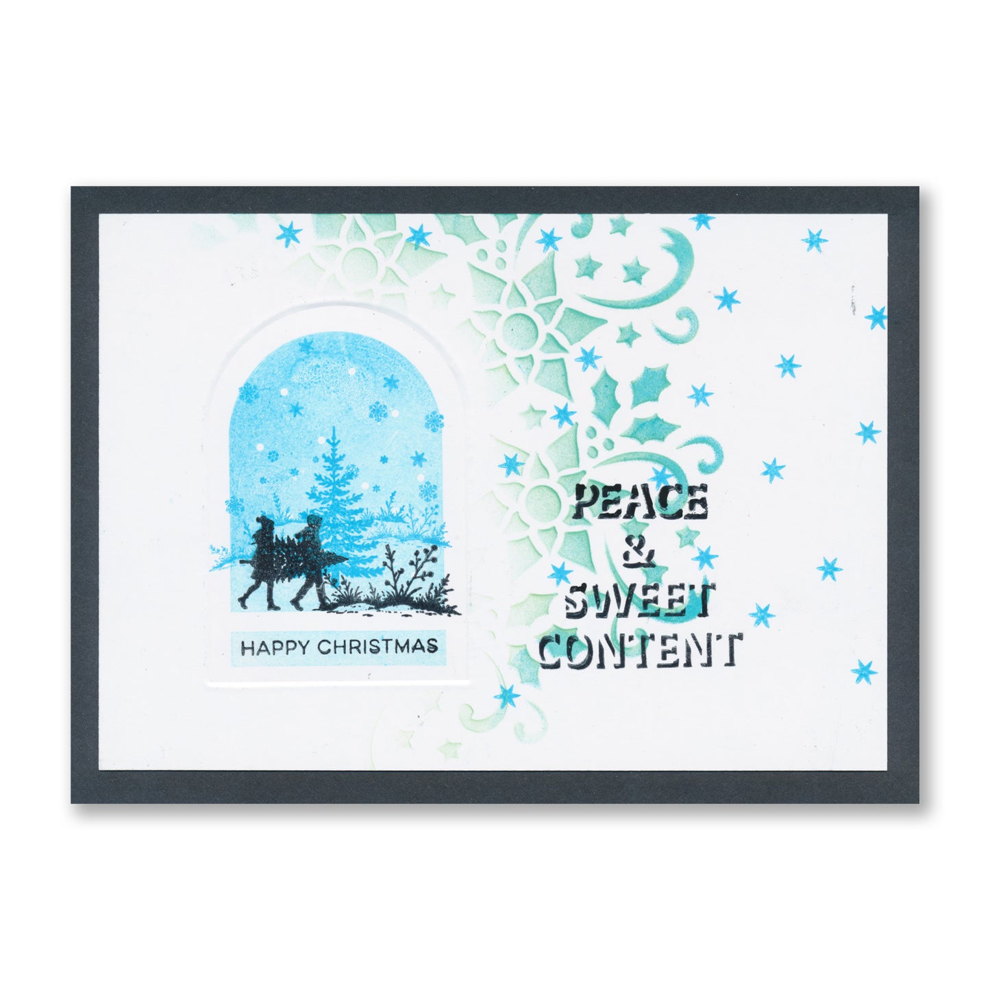 Handmade Christmas card featuring two figures carrying a Christmas tree inside a bell jar with the "Happy Christmas" and "Peace & Sweet Content" sentiments created with the Christmas Bell Jar Sentiments A7 Stamp Set with Embedder