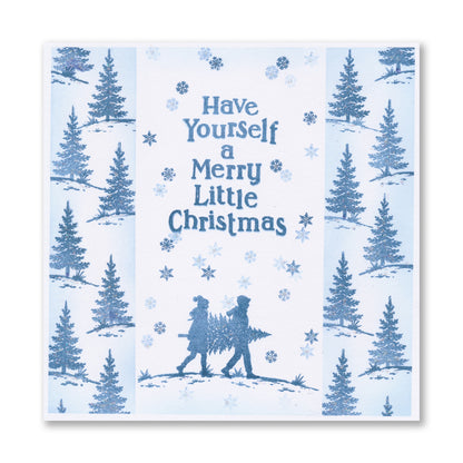 Handmade Christmas card featuring two figures carrying a Christmas tree with the "Have Yourself a Merry Little Christmas" sentiment created with the Wee Christmas Friends & Family Silhouettes A5 & A7 Stamp Collection