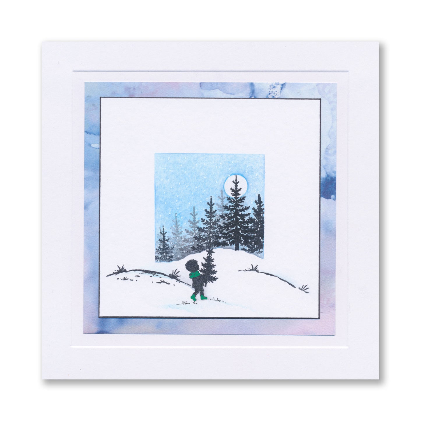 Handmade Christmas card featuring a child carrying a Christmas tree through a snowy landscape created with the Wee Christmas Friends & Family Silhouettes A5 & A7 Stamp Collection